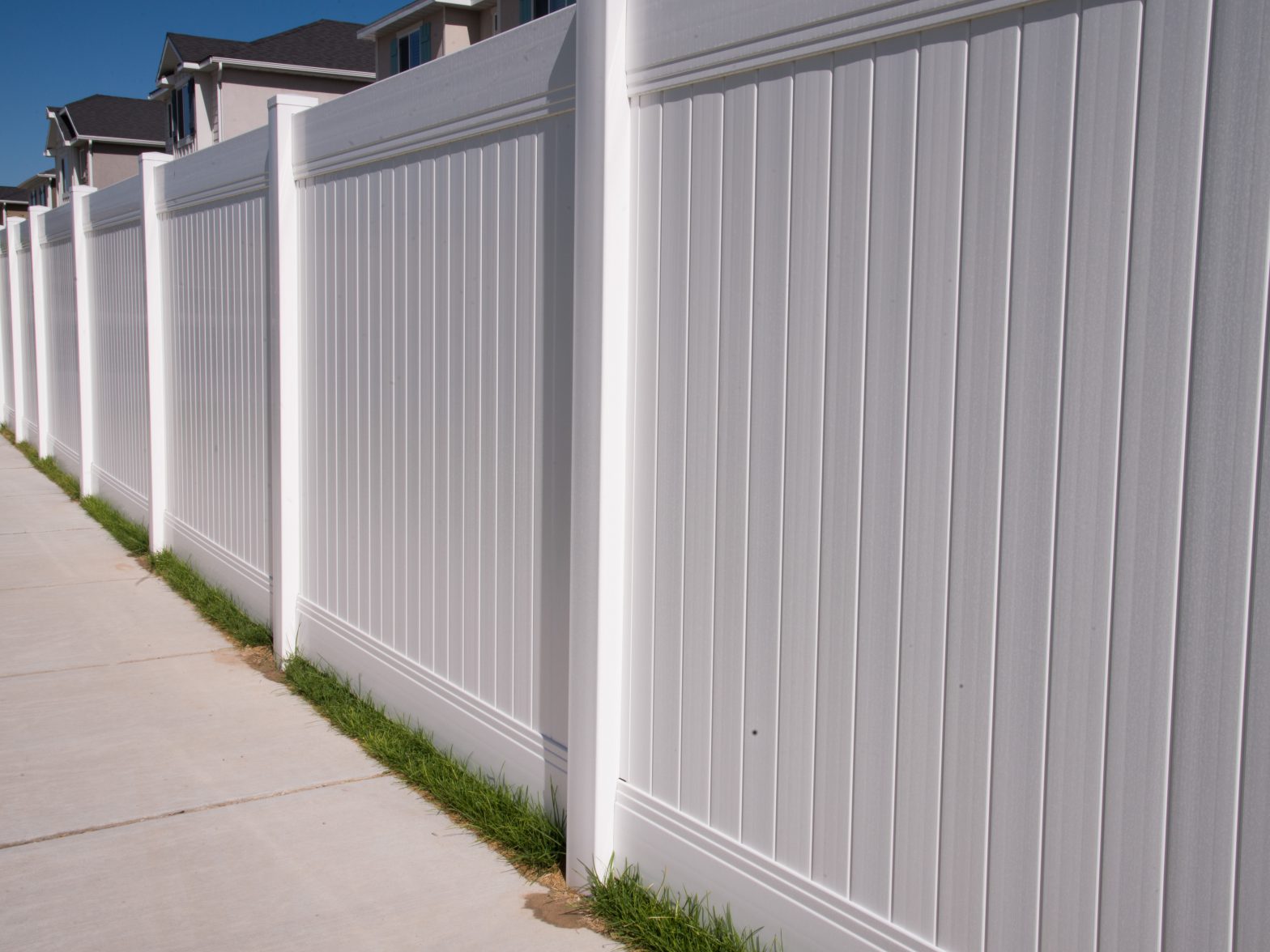 Photo of a full privacy white vinyl fence