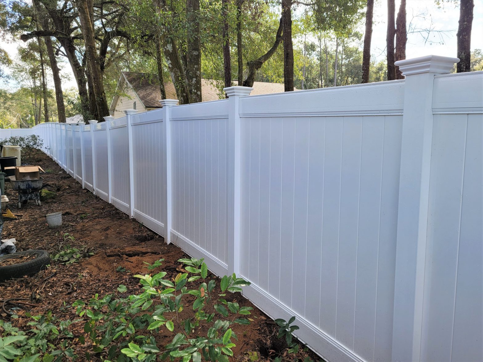 Photo of a white privacy vinyl fence